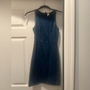 Body con Denim mini dress with the back out.